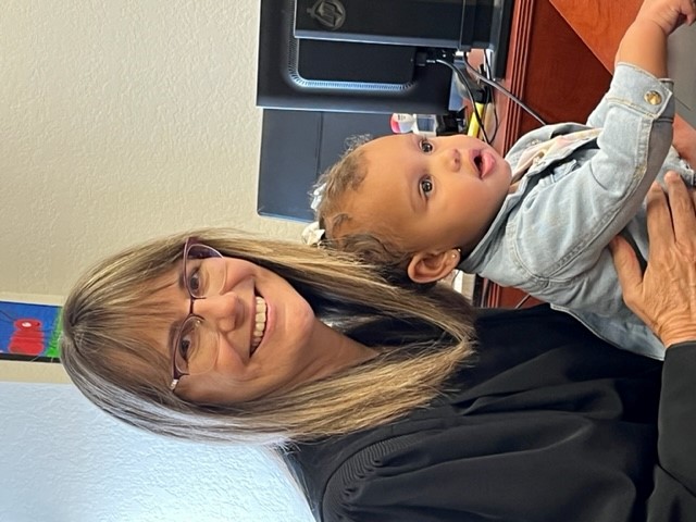 Mother with child in Judge Pinckett's office